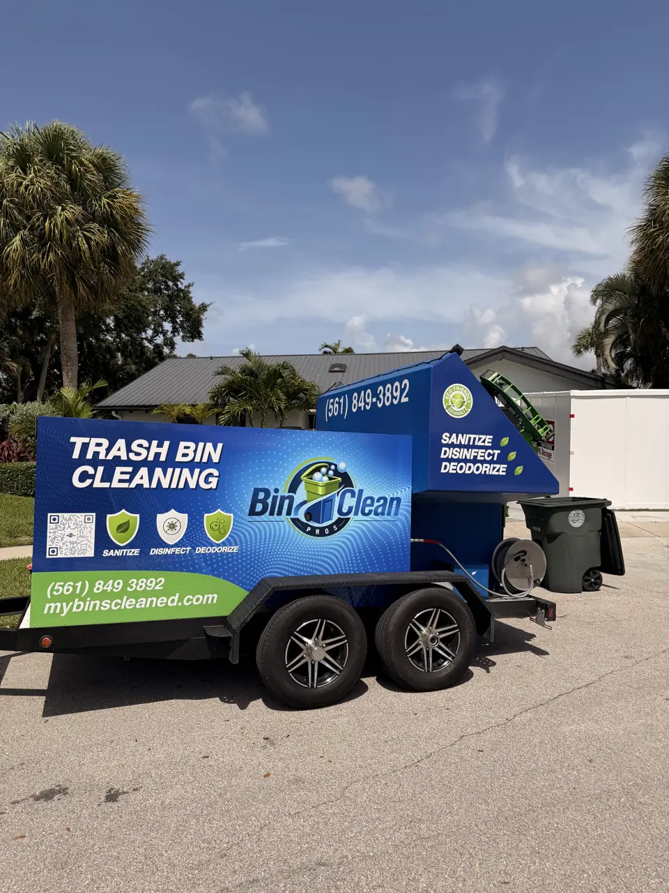 The Bin Clean Pros truck on a sunny South Florida street